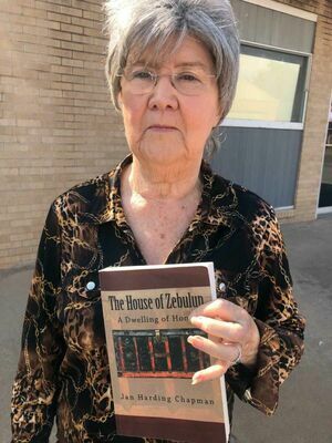 Carnegie's Jan Harding Chapman displays the book she wrote about her family's journey to Southwestern Oklahoma during the 'Land Run.' The book details many incidents of early-day Carnegie and Caddo County.
